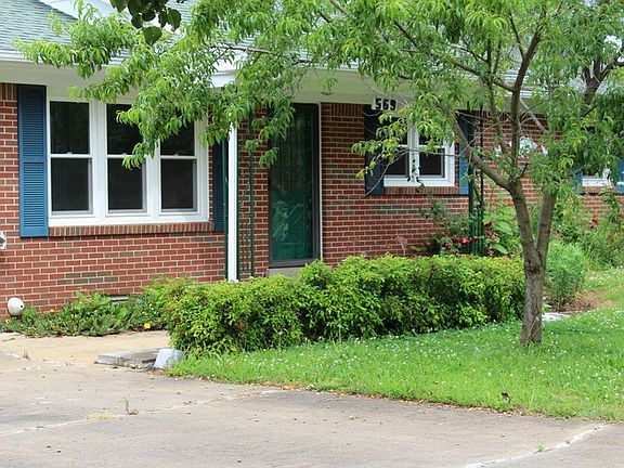 Front Porch and Door : Well-treed yard conceals the beauty of this ranch home.