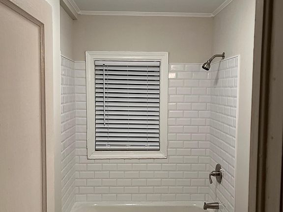 Bathroom with full bathtub & shower