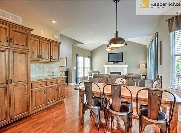 Gleaming hardwoods throughout the kitchen which offers plenty of space for a large table for 6 people.  The double door pantry offers plenty of storage and notice the generous countertop space and additional cabinets.