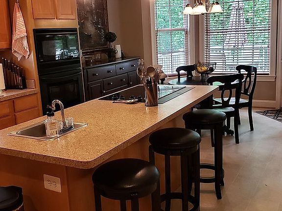 Kitchen Wooded View to Patio