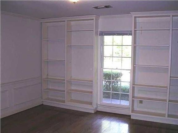 Formal dining room has built-in shelves