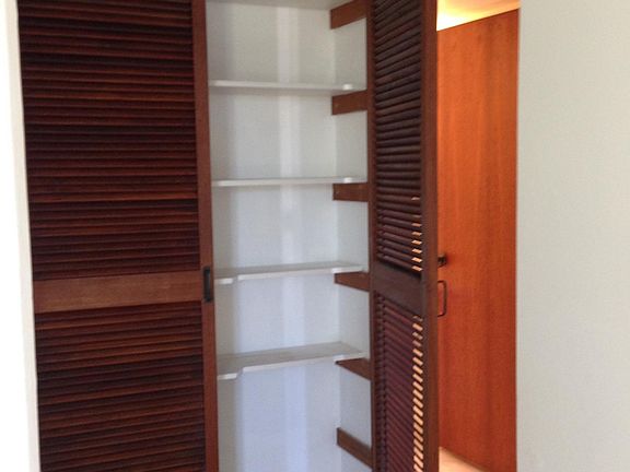 Hall linen closet w/teak doors