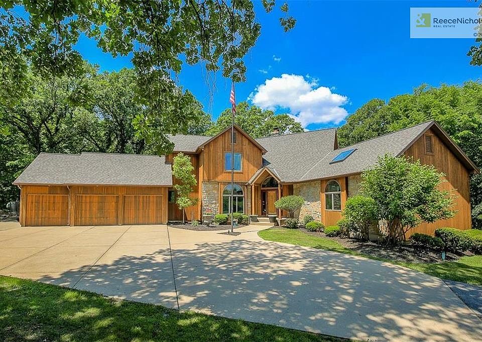 Impressive 1.5 story home with walkout lover level and a 4 garage with the 4th car on the left side