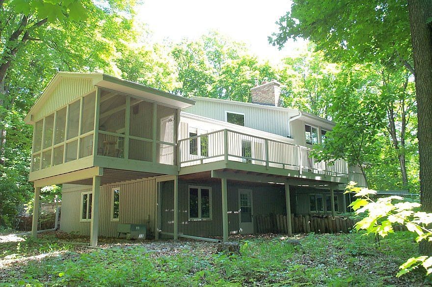 Tucked into the woods and private from all sides