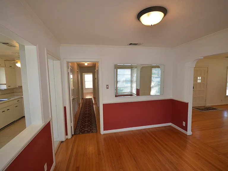 Hardwood flooring throughout the main living areas and hallway.