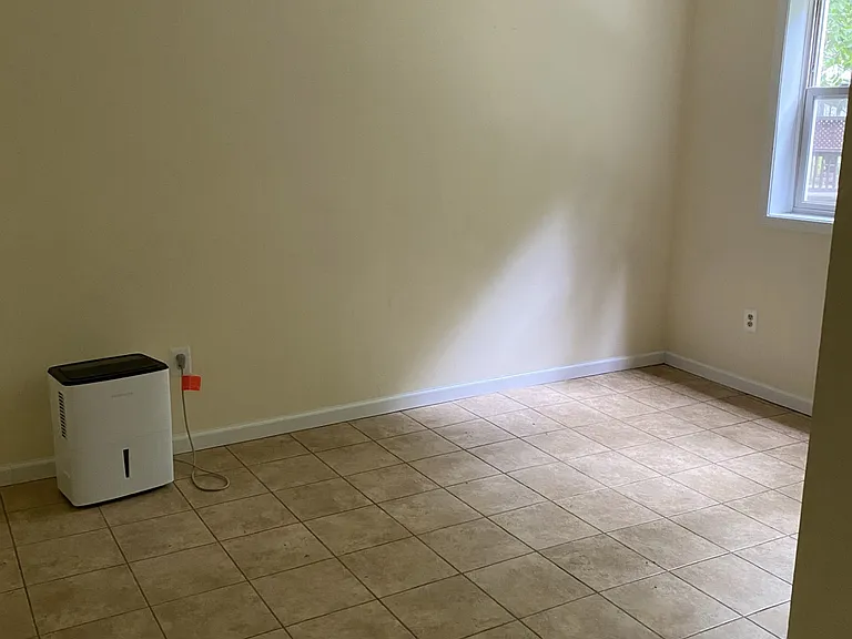 The bedroom has space for a queen bed or a twin bed and desk.