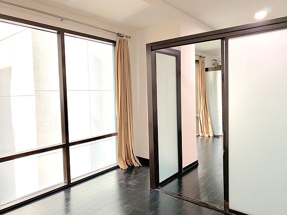 View from the primary bedroom into living room