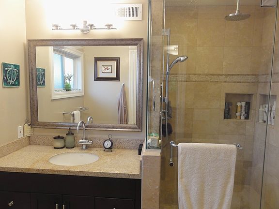 master bath with rain head shower in ceiling