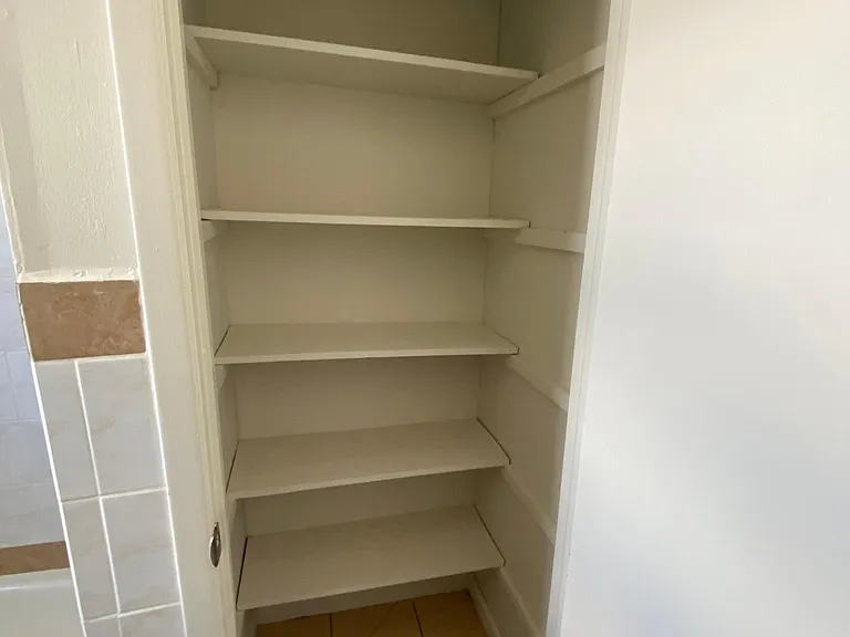 Storage closet in bathroom