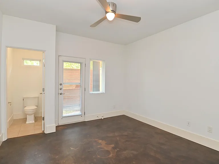 2nd guest bedroom or office space on 1st floor with jack and jill bathroom and door to backyard space.