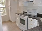 Upgrades in Kitchen with cabinets, counters, porcelain sinks