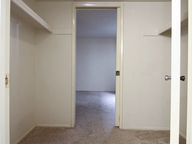 Walk-in closet view from the bathroom