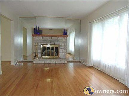 Living room with wood burning fireplace