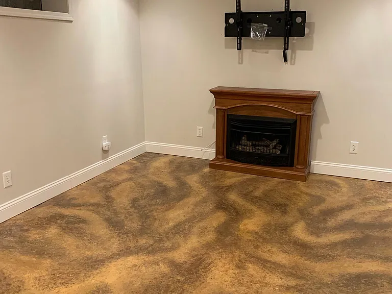 Family room in basement with gas fireplace and wall mount for TV
