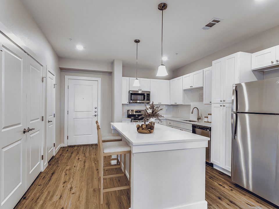 Encounter the elegance of this modern kitchen, perfect for culinary adventures and entertaining.