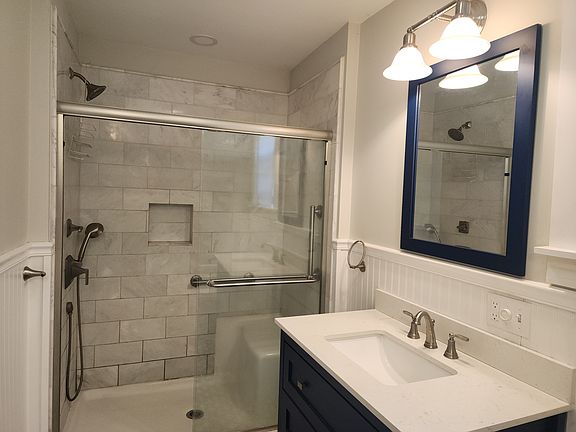 Shower on the opposite side of the tub