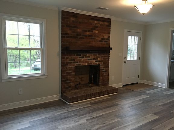 Den with fireplace 