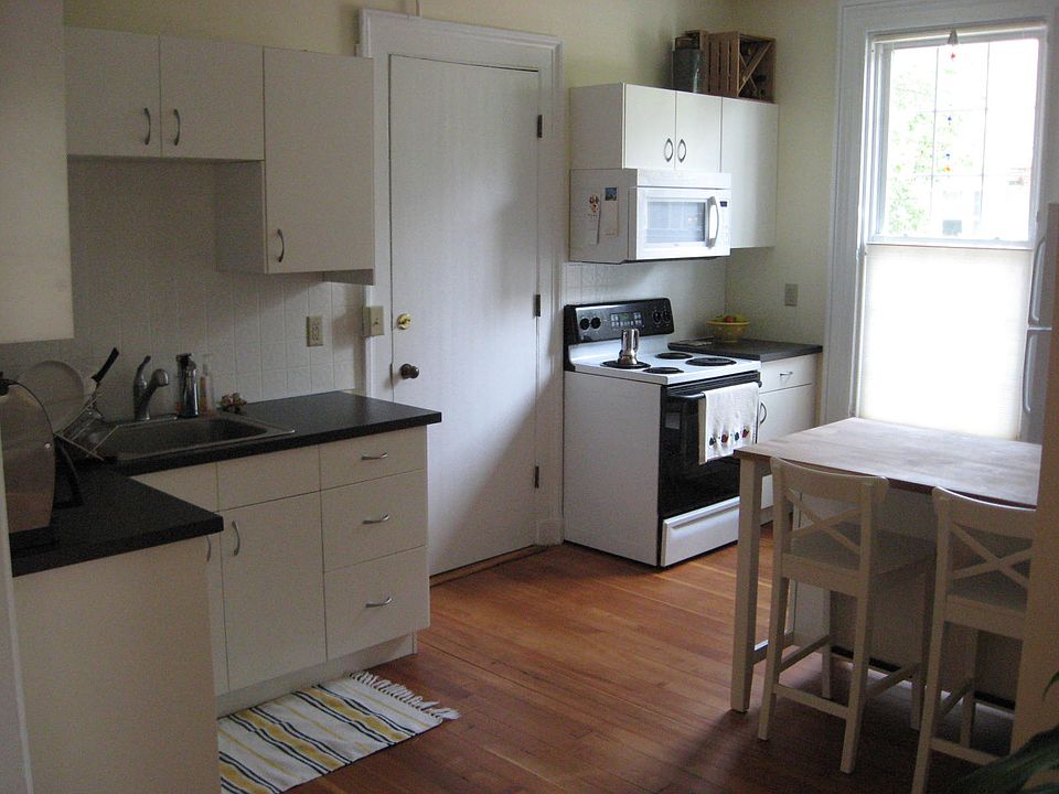 Kitchen - faces Orange St (East). Entrance to apartment from front hall.