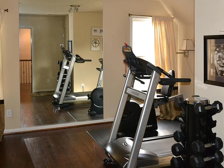 Exercise room includes treadmill