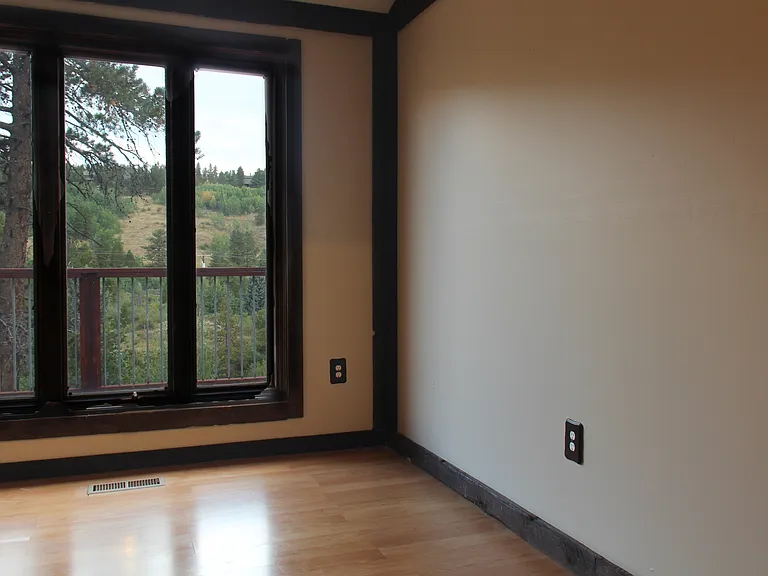 Guest bedroom or office with dramatic views from the large 7 ft windows