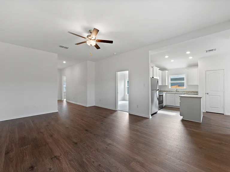 Spacious family room and adjoining kitchen.