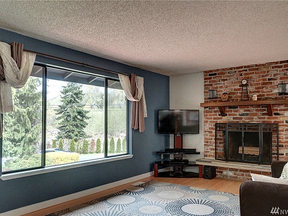 Beautiful fireplace with mantle made from reclaimed dock wood.