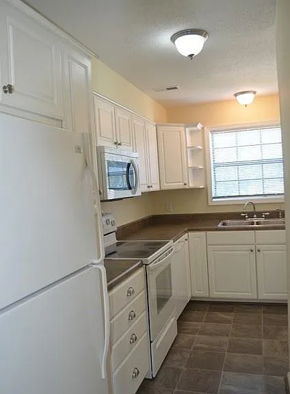 Kitchen has been updated & has great cabinet & counter space!
