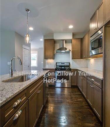 Kitchen with all stainless steel appliances.