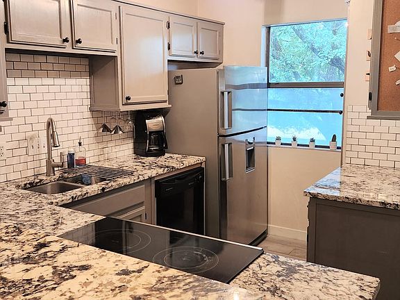 Fully stocked kitchen with bar seating