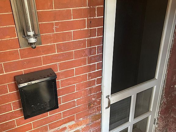 Entrance to basement apartment (with light and mailbox)