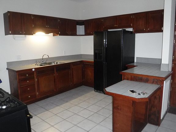 Loads of cabinets & breakfast bar