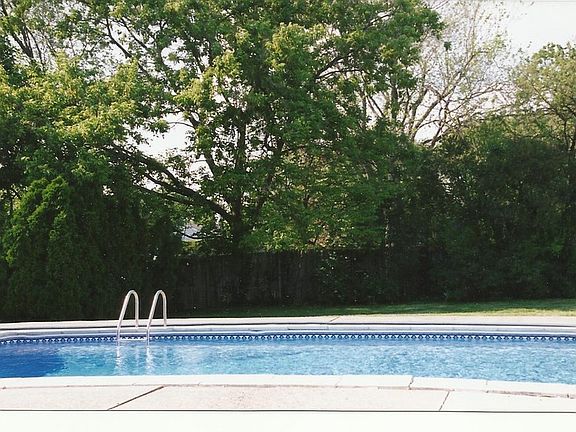 SIDE VIEW OF POOL PRIVATE BACKYARD