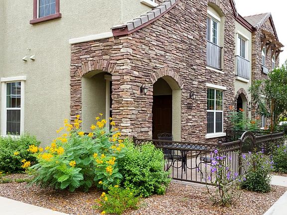Front door, porch/patio on the end, facing north. Master bed