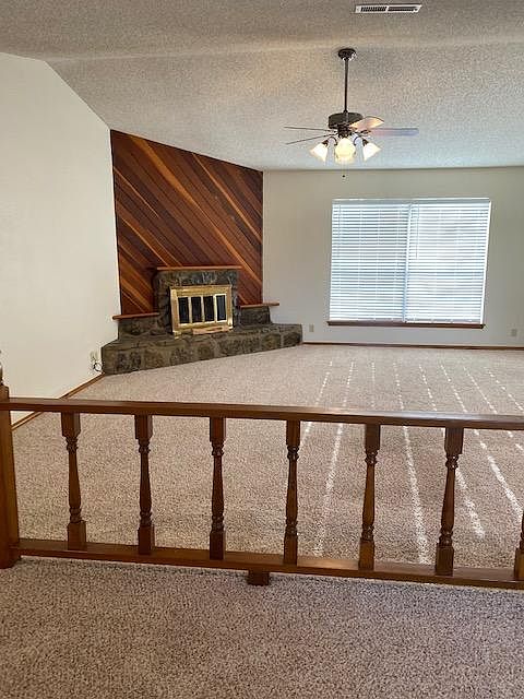 Large great room, with additional area for entertaining, or setting area. New paint, newer carpet.