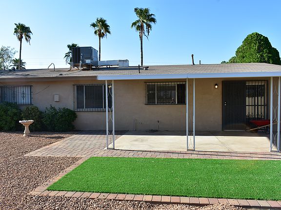 Covered patio, low maintenance yard with green area