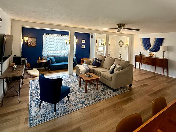 Furnished Living Room, Sitting Room with wood stove, and Kitchen Bar