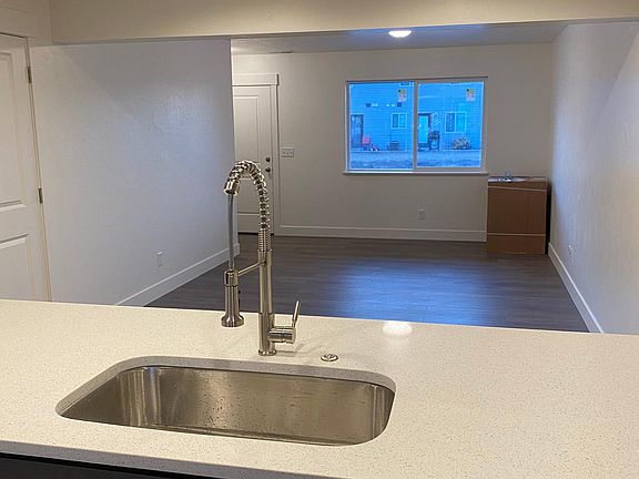 Open floor concept with laminate hardwood flooring