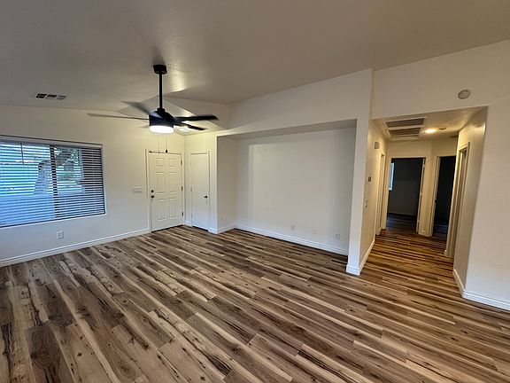 Spacious living room with brand new flooring and plenty of natural light