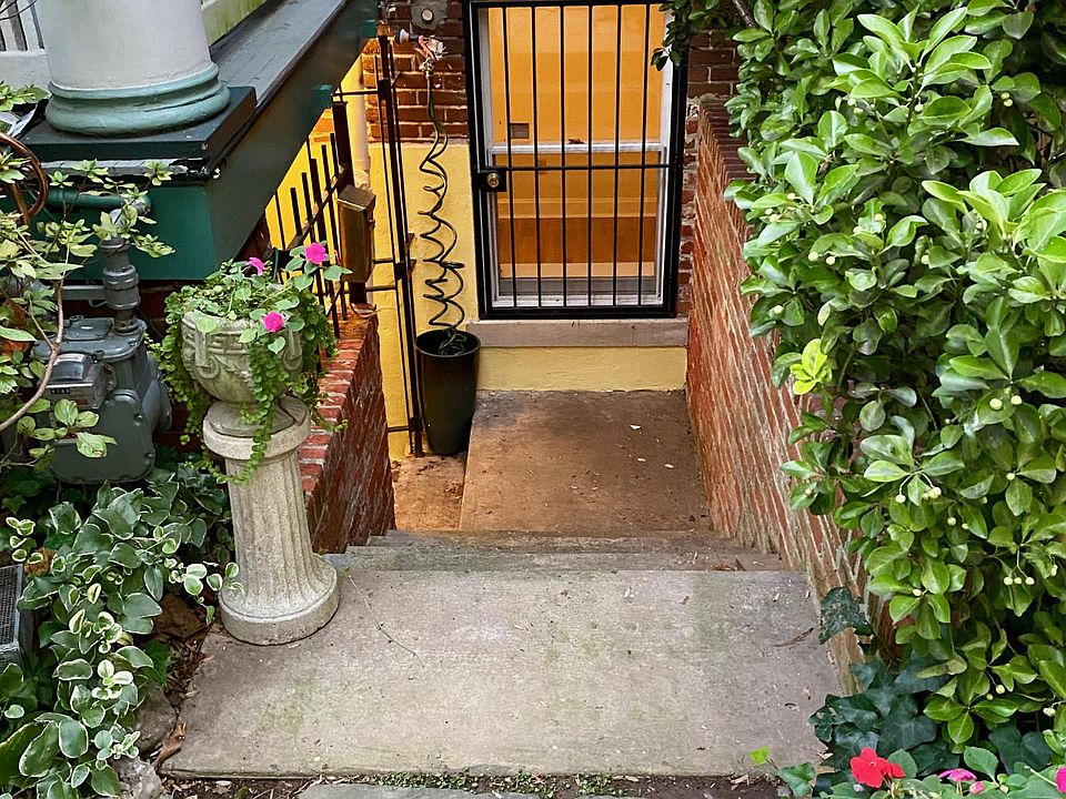 Front entrance with bedroom window.