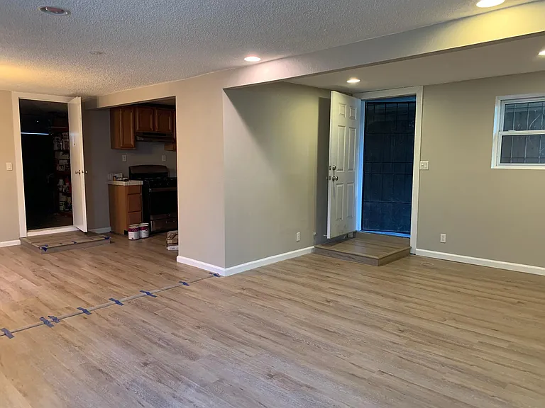 Main living/dining/kitchen area, looking at front door