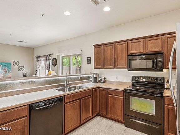 4th image of 8759 W SURREY Avenue