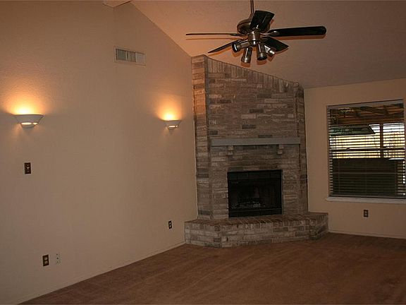 Family room with view of wood burning fireplace