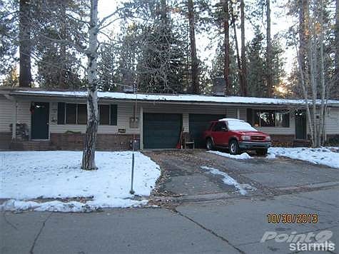Paved driveways and each garage is equipped with an electric garage door opener