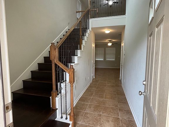 Stairs to living room while game room is located on 1st floor.