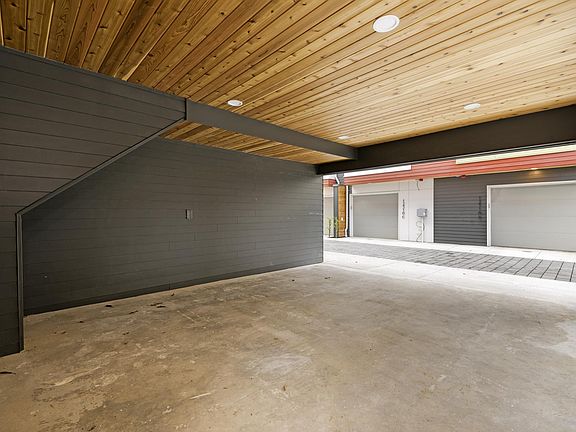Huge carport parking big enough to park big SUV , plus bike.