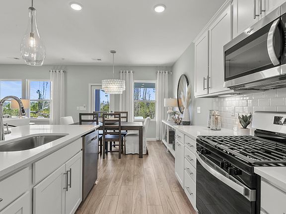 The new home Hartwell showcases a beautiful and spacious kitchen.