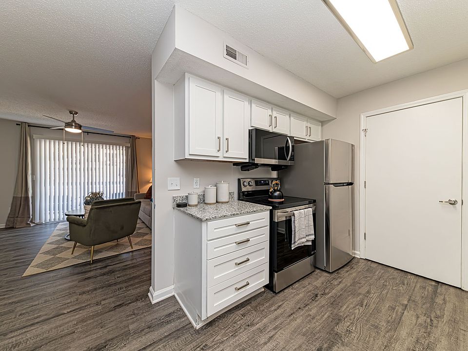 Kitchen with modern cabinetry & stainless appliances