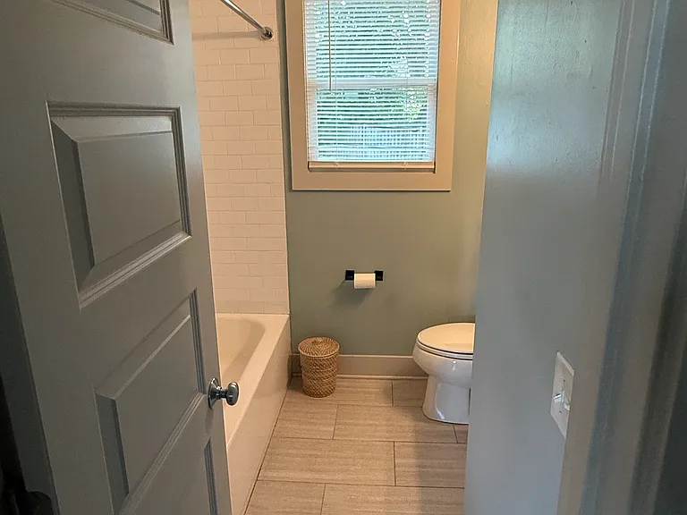 The bathroom walls are being repainted white