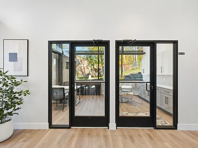 Step into modern living at Eagle Rock Apartments at Woodbury. This stunning unit showcases an inviting indoor-outdoor flow with expansive glass doors leading to a private patio oasis. Your perfect home awaitsexplore the possibilities today!