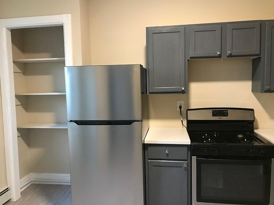 stainless appliances, stained hardwood cabinets, ample pantry space